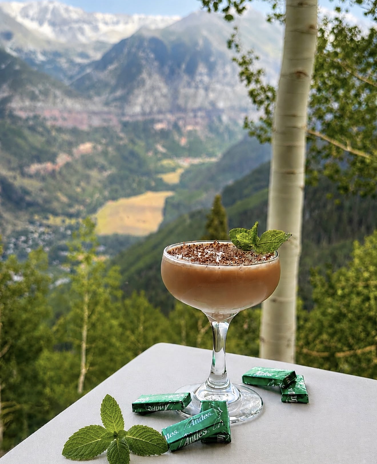 A chocolate mint cocktail at Allred's, garnished with mint and Andes candies, overlooking the Telluride valley