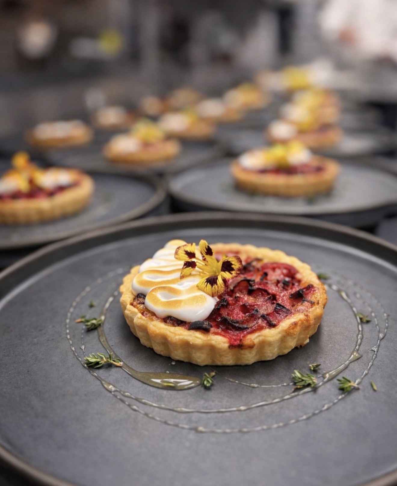 A strawberry tart with torched meringue, a dessert course at Allred's